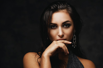 sexy raven indian lady posing seductively in front of camera