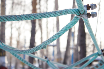 Ropes, rope knots on the background of trees