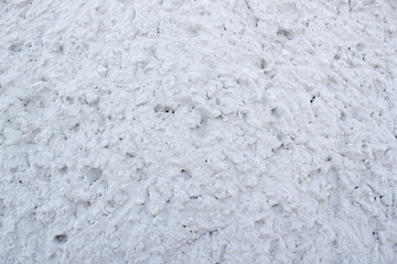 Concrete grey wall with cracks closeup