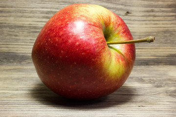 Red Apple on wooden background