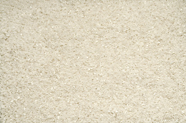 Textured background of rice grains on the surface