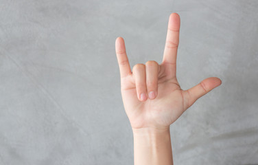 Hand action gesture on grey background