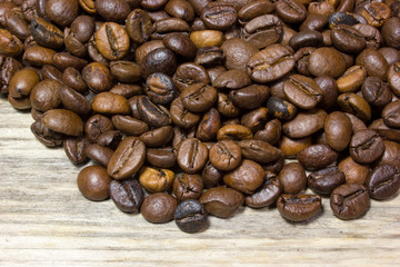 Coffee beans on wooden background