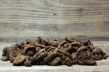 Dried mushrooms on wooden background