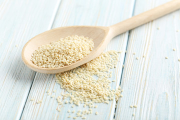 Sesame seeds on a blue wooden table