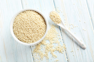 Sesame seeds on a blue wooden table