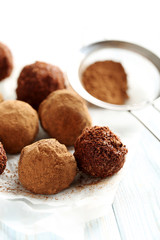 Sweet chocolate truffle on a blue wooden table