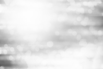 Artistic style - Defocused abstract white and gray bokeh lights background with blurring lights for...