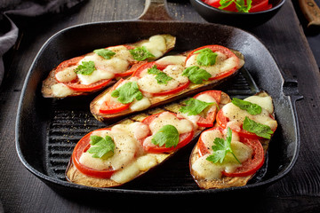 Baked eggplant with tomatoes and cheese