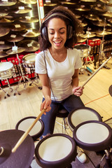 Woman playing electronic drums