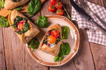 farmer baguette filled with egg, bacon and spinach