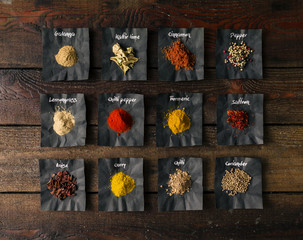 Colourful spices on wooden table