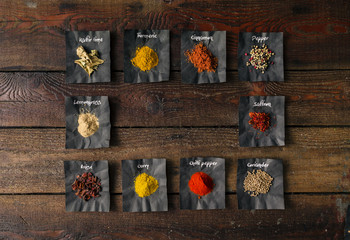 Colourful spices on wooden table