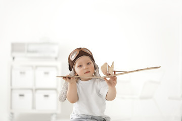 boy with airplane in hand