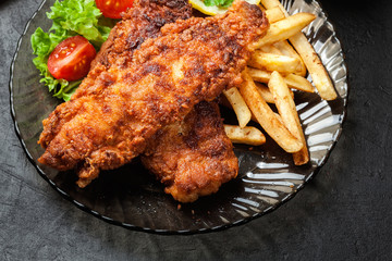 Fried fish in crispy batter with chips