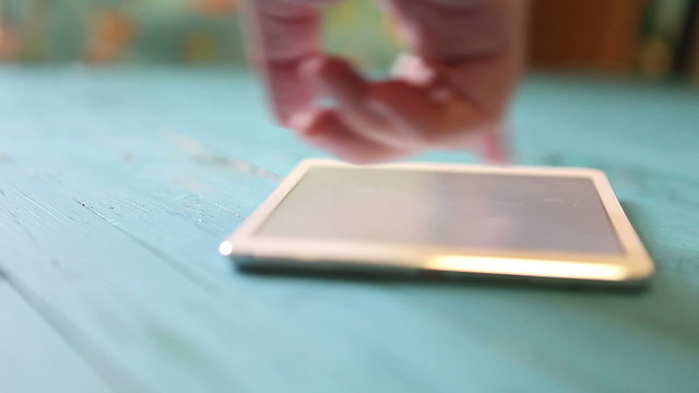 man uses tablet. strong blur. close-up