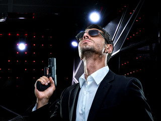 Contract killer holding a gun