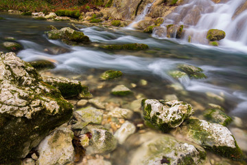 Beautiful waterfalls and mountain stream in Transylvania, in early spring