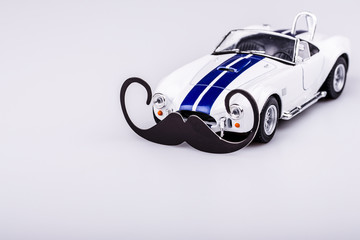 bautiful blue and white car, roadster with mustache