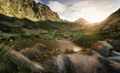 Mountain landscape with lake in sunshine