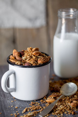 Healthy breakfast. Fresh granola, muesli in a glass jar. copy space.Organic oat,almond and sunflower seeds