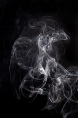 White smoke on a black background.