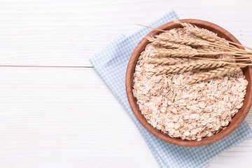 oat flakes on wooden table.healthy food concept.