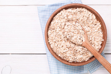 oat flakes on wooden table.healthy food concept.