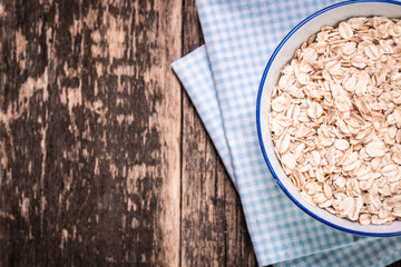 oat flakes on wooden table.healthy food concept.