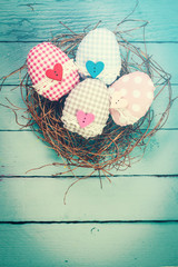 Easter concept with colorful eggs on wooden background