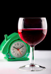 Glass of wine and clock