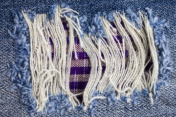 Jeans torn denim texture.