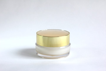 transparent container with golden cap
