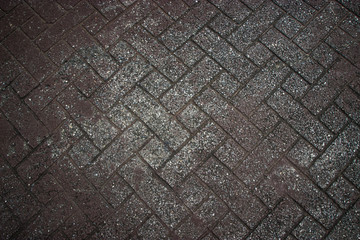 Background texture of gray tiled pavement city ground.