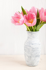 Fresh pink tulips in a  jug