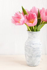 Fresh pink tulips in a jug