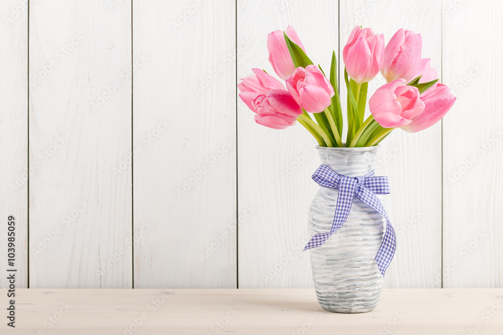 Poster fresh pink tulips in a jug