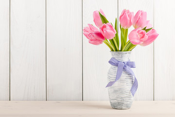 Fresh pink tulips in a  jug