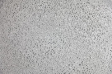 Drops of water on clear glass.