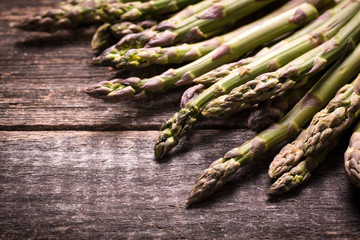 Fresh asparagus on wooden table , diet concept