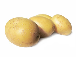 close-up of raw potatoes, isolated on white