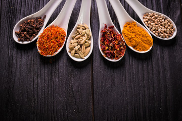 spices and herbs on wooden table , medicinal concept