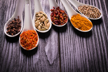 spices and herbs on wooden table , medicinal concept