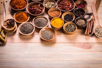 spices and herbs on wooden table.
