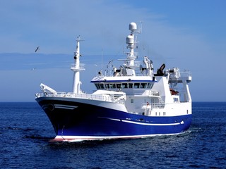 Fototapeta na wymiar Fishing Vessel P1, Fishing Vessel underway to harbour to land fish.