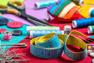 Various sewing accessories on a colored felt.