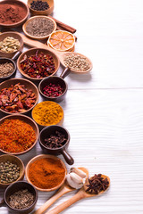 spices and herbs on wooden table.