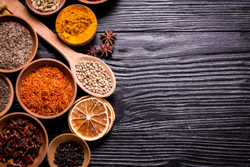 Obraz na płótnie Canvas spices and herbs on wooden table.