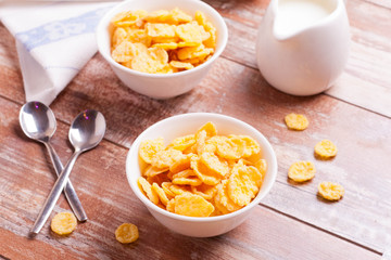 Cornflakes and milk for breakfast closeup