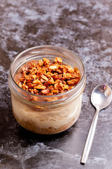 dessert with cream, granola and jam, closeup